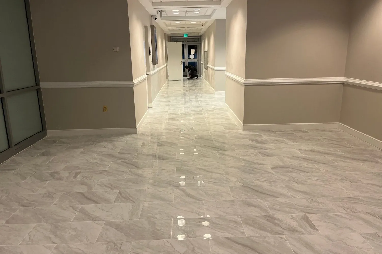 Same corridor with new large-format porcelain tile