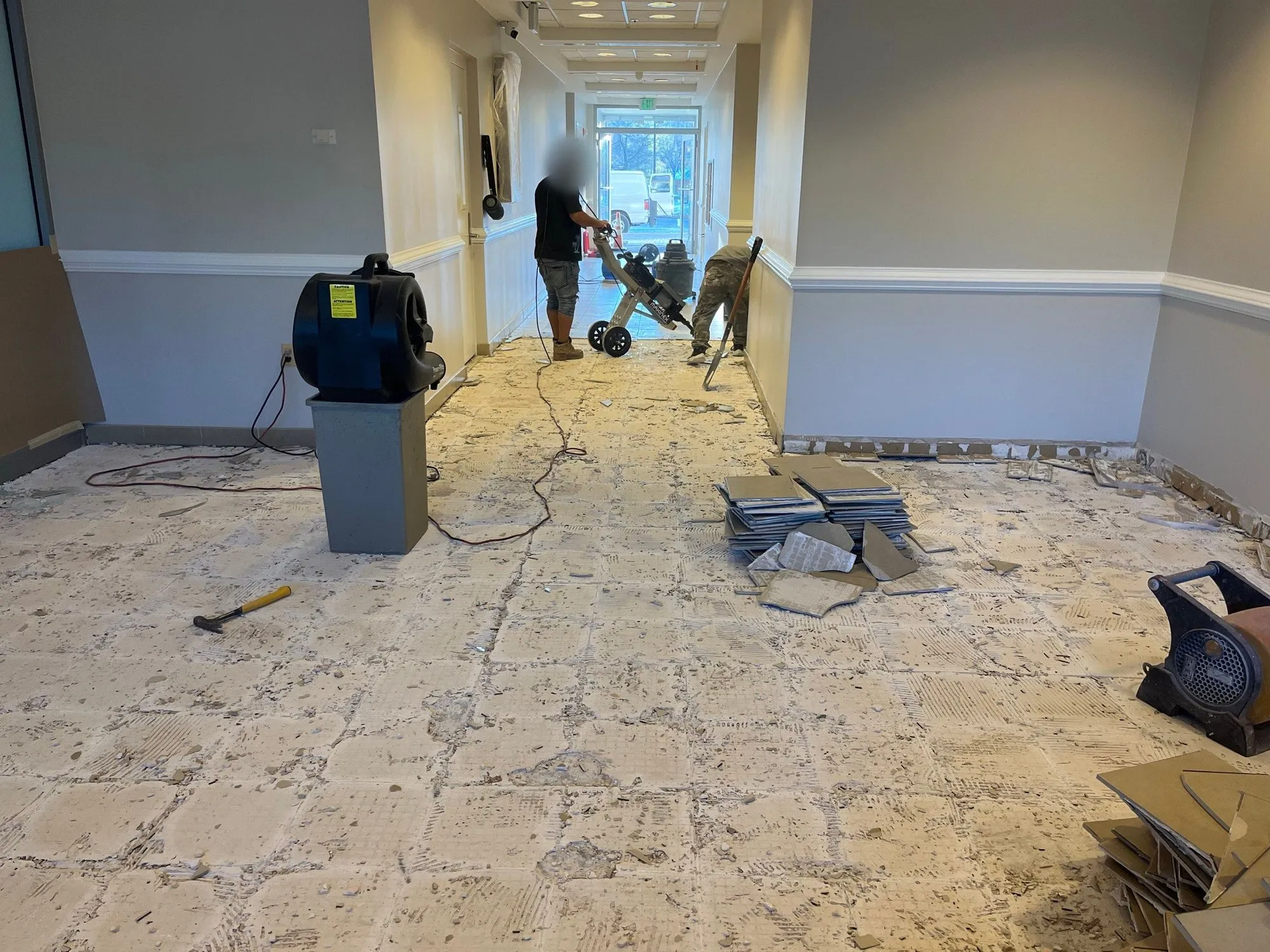 Office corridor with the old tile floor torn up