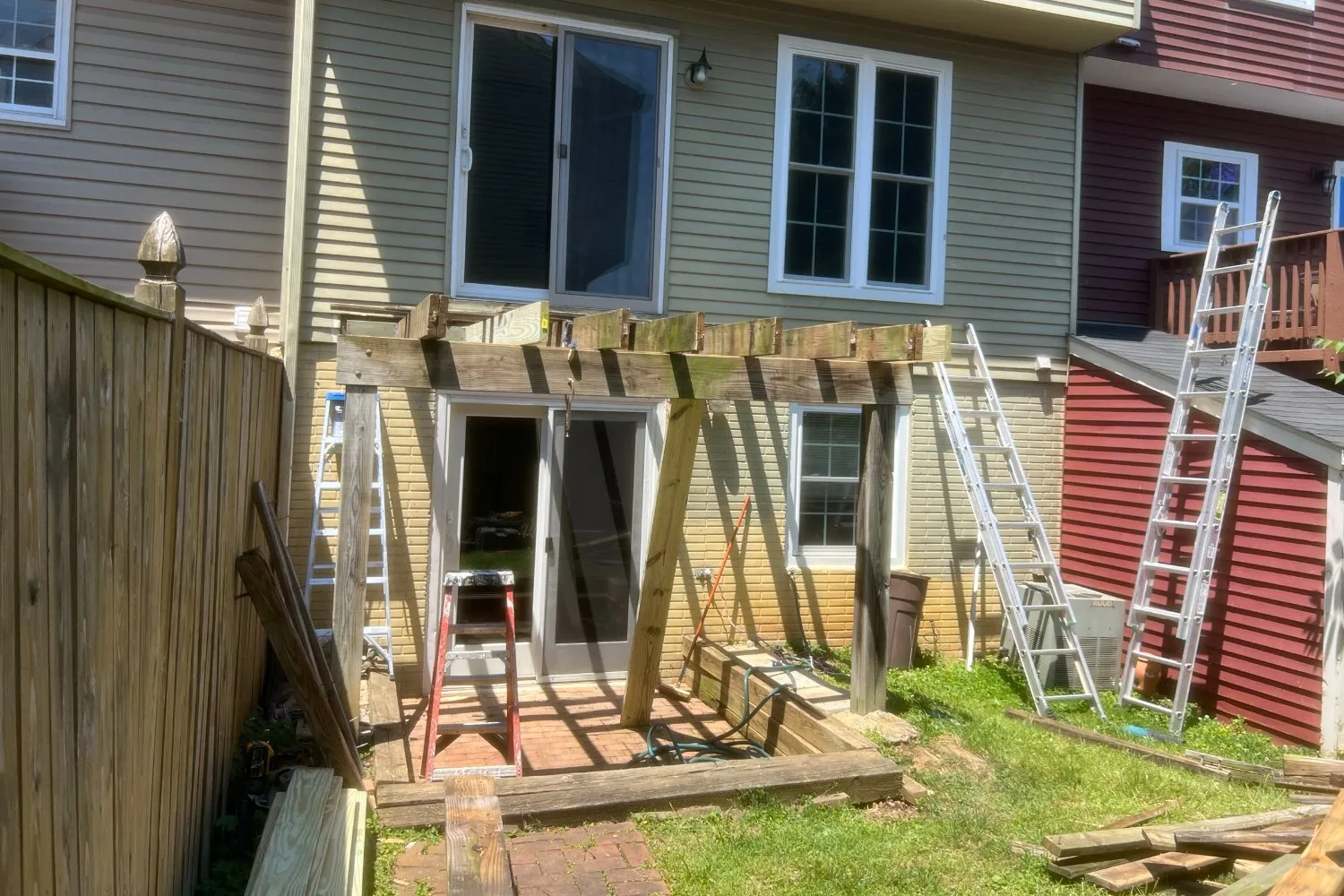 Old townhouse deck torn off down to the posts and beams